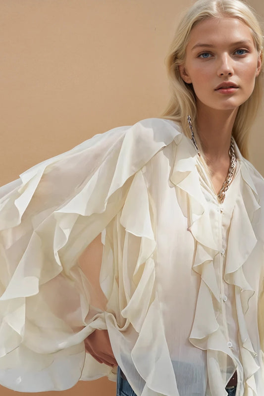 Close up of the crinkle chiffon ruffle detail across the shoulder and sleeve