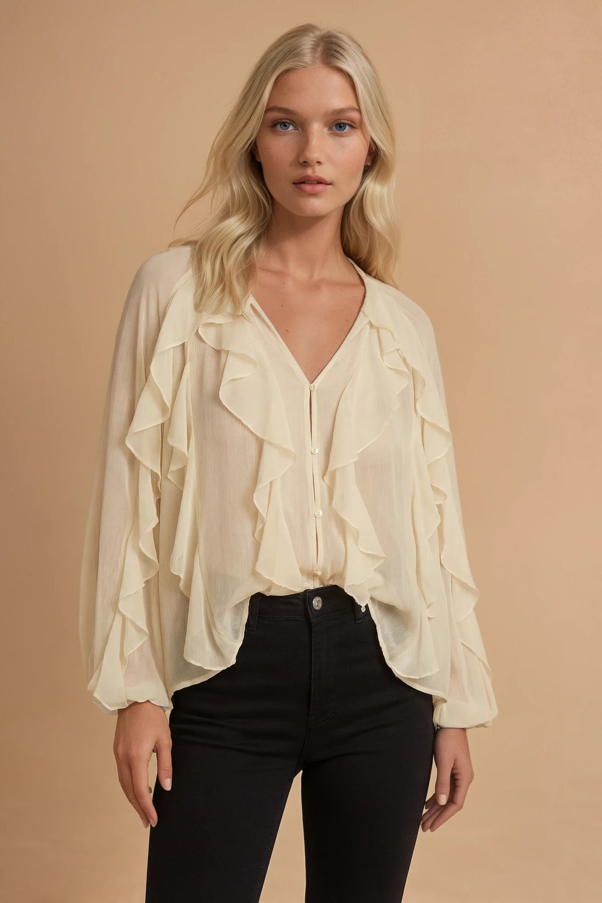 Front view of cream sheer ruffle button down blouse worn with black high rise jeans