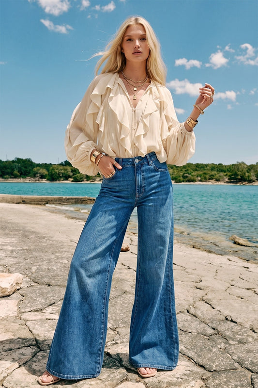Cream sheer ruffle blouse styled with wide leg denim, front view